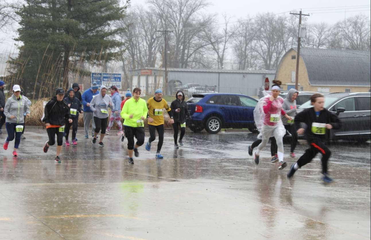 The runners for March For Meals 2019 5K Race take off from the starting line!